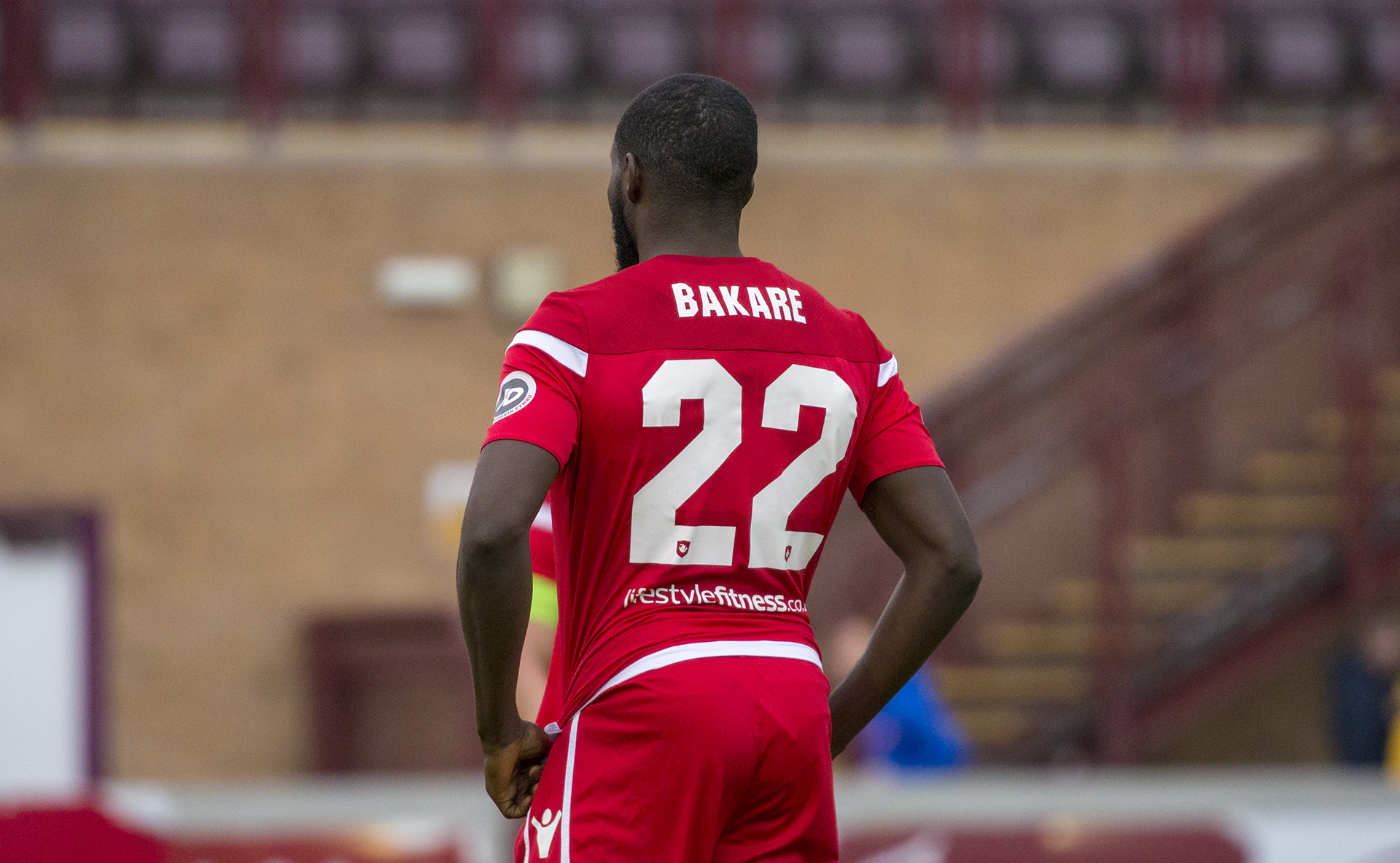 Michael Bakare has signed a new deal at Connah's Quay Nomads until 2020